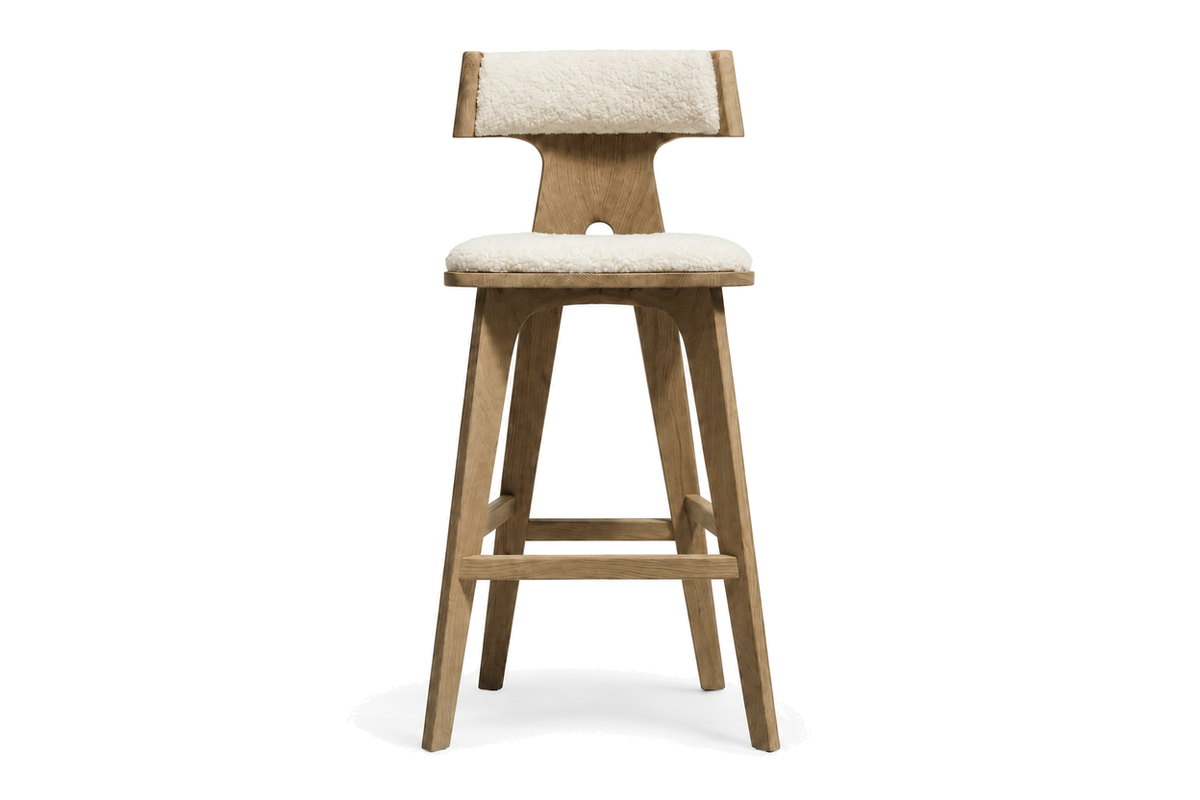 House of Coda Fulcrum teak barstool with a light upholstered seat on a white background.