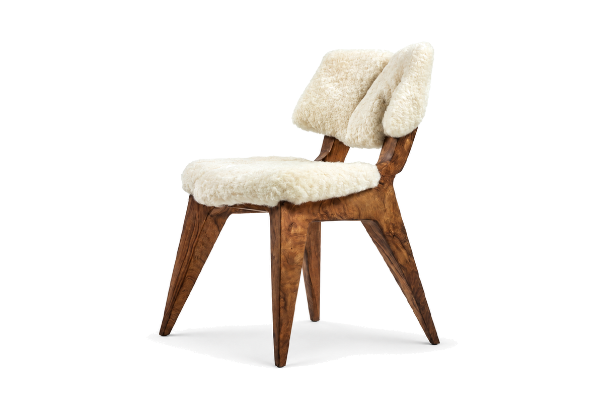 House of Coda Rift side chair with a sculptural teak frame and white fur upholstery on a white background.